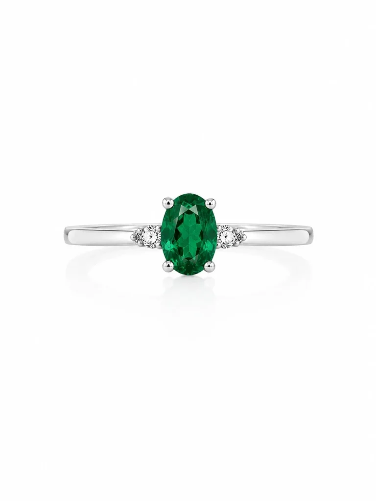 Anillo oro blanco con esmeralda central